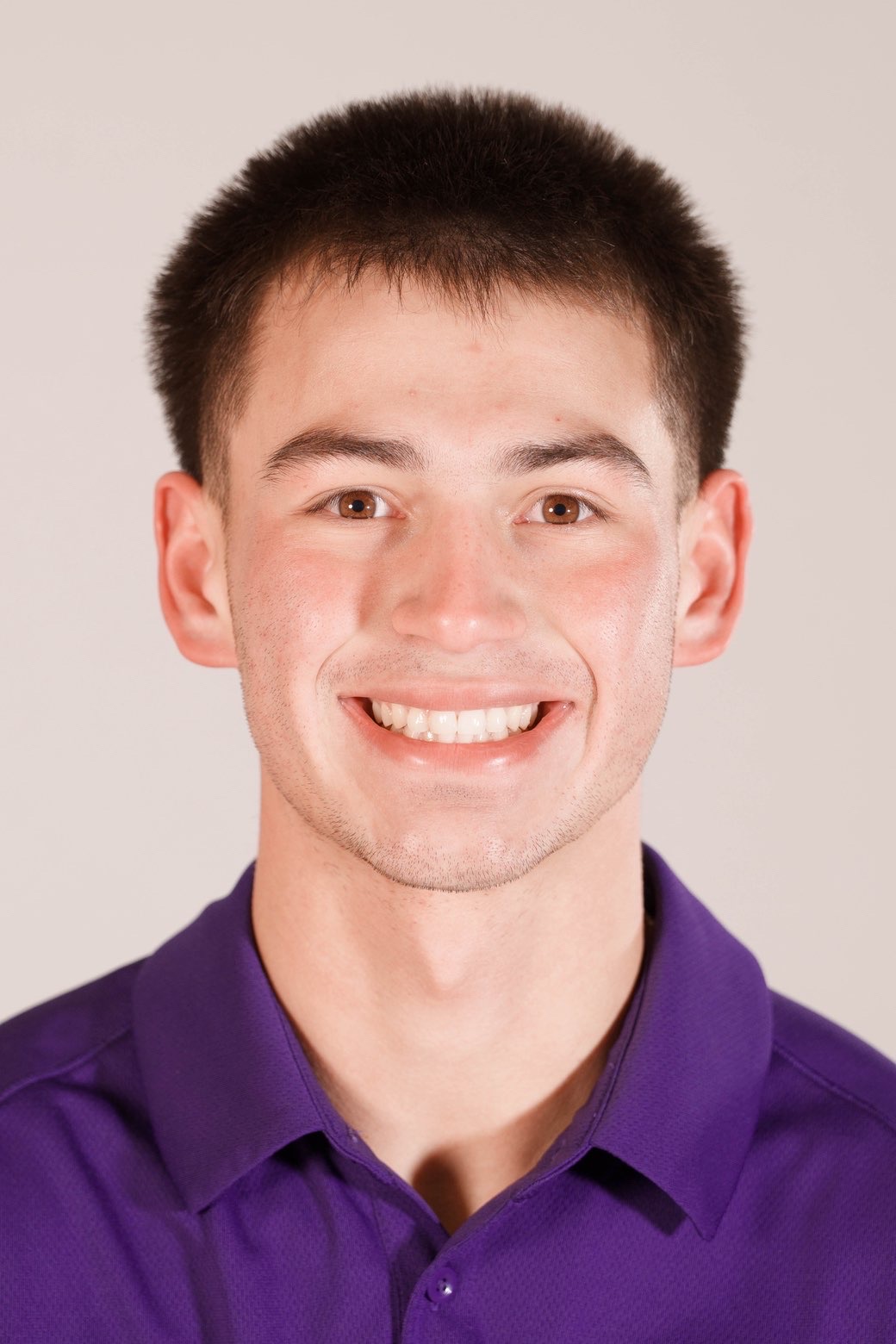 Portrait headshot of Pete Bacon in a College of Idaho polo