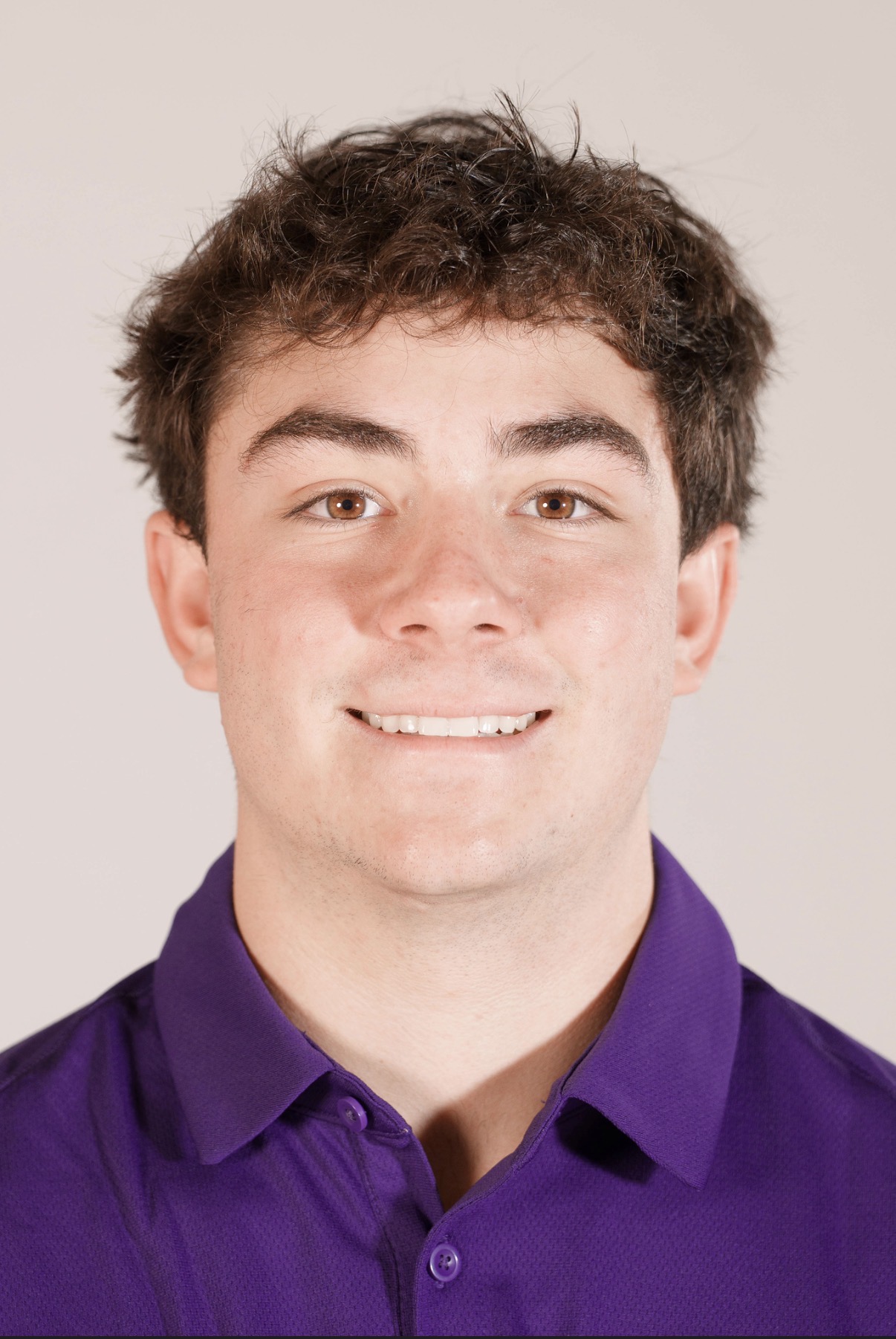 Portrait headshot of Jax Copeland in a College of Idaho polo