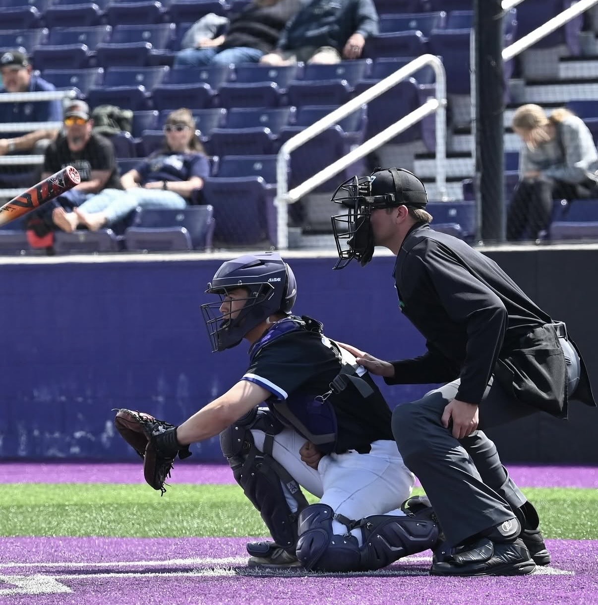 Pete Bacon receiving a pitch behind the plate